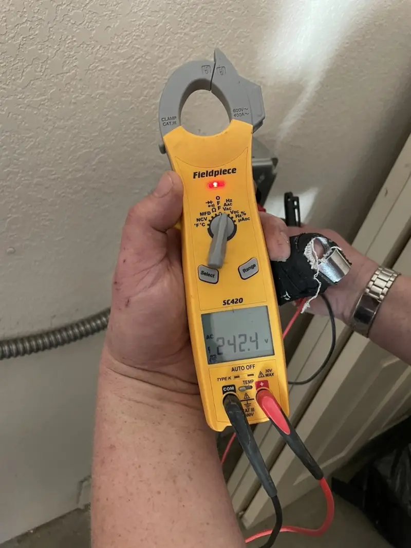 Voltage testing with clamp meter during Electrical Installation Services in Wood Village